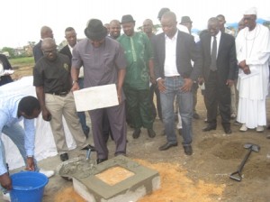 Sir, Patrick Ferife, representing Governor Emmanuel Uduaghan laying the foundation stone of the Delta City Mall, Effurun, Delta State, while others look on