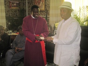 Delta State Flood Management Committee Chairman, Justice Francis Tabai (right) presenting the Cheques to Arch Bishop Goddowel Awomakpa, Chairman CAN, South/South. 