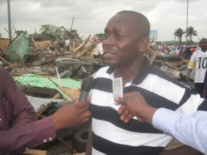 Frank Omare, Delta State Commissioner for Environment, speaking to the press during the demolision exercise.