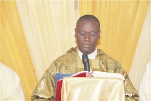 Rev. Fr. Jude U. Sagbadje Principal of Good Shepherd Catholic Boys' Secondary School, Oyede reading his address