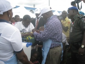 Governor Emmanuel Uduagha immunizing one of the children during the flag-off of the third quarter polio eradication sensitization campaign held in Warri City Stadium