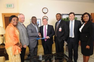 Clay Neff (in the middle), Chairman & Managing Director of Chevron Nigeria Limited (CNL) exchanges the agreement of the sale of  CNL’s interest in OMLs 52, 53 and 55 with Austin Avuru (third right), Chief Executive Officer, Seplat Petroleum and representative of the Seplat Consortium comprising of Seplat, Amni and Belemaoil - in Lagos. Others are:  (left to right) - Mirian Kachikwu, General Counsel, Seplat Petroleum ; Stuart Connal, Chief Operating Officer, Seplat Petroleum; Nedo Osayande, I. 