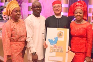 Delta State Commissioner for Information, Hon. Patrick Ukah, representing Governor Ifeanyi Okowa (2nd Left) and his wife, Mrs Ukah (left), presenting a Special Birthday Card and a Special Letter from the Governor to Prof. Pat Utomi (2nd right) and his wife, Ifeoma, during the Professor's 60th birthday celebration in Lagos.