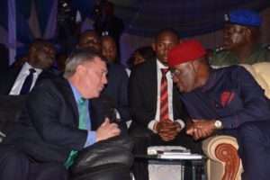 Chairman/MD CNL (L) and Governor Okowa in a chat during the Summit. 