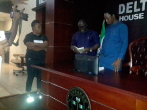 Rt. Hon. Sheriff Oborevwori, DTHA Speaker taking his oath of allegiance to office while Deputy Speaker and Clerk look on