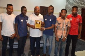 3rd Left: Hon. Chief Evance Ochuko Ivwurie, Member Representing Ethiope East State Constituency in the Delta State House of Assembly, Asaba with the Award of Excellence  and members of the students' group in Abraka Community  