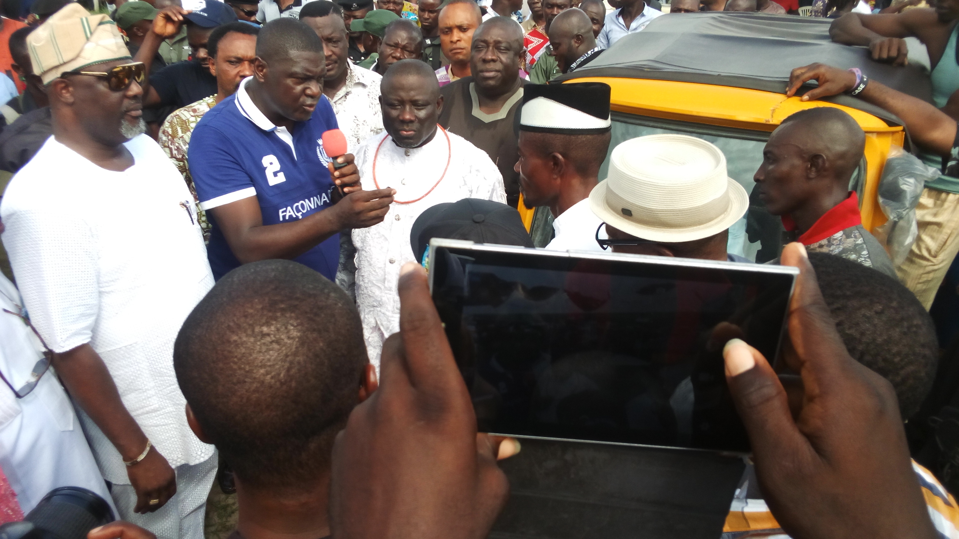 Hon Solomon Ahwinahwi, member representing Ughelli North, Ughelli South and Udu federal constituency in the Federal House of Representatives (m) handing over the keys of a tricycle to one of the beneficiaries while Hon Dino Melaye (left) and Right Hon Sheriff Oborevwore, Speaker, Delta state (right) and others look on. 