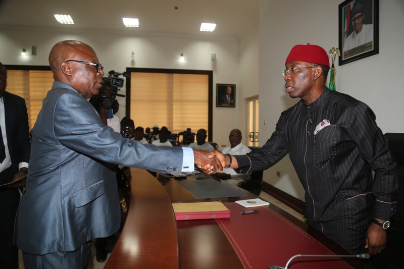Delta State Governor, Senator Ifeanyi Okowa (right) congratulating the newly sworn-in Chairman, Delta State Independent Electorial Commission (DESIEC) Chief (Barr.) Michael Ogbodu during the swearing-in ceremony in Asaba. 
