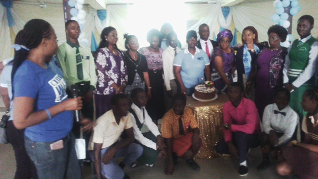 Members of Medical a Women Association of Nigeria, Delta State with some students cutting the cake to mark World Food Day.